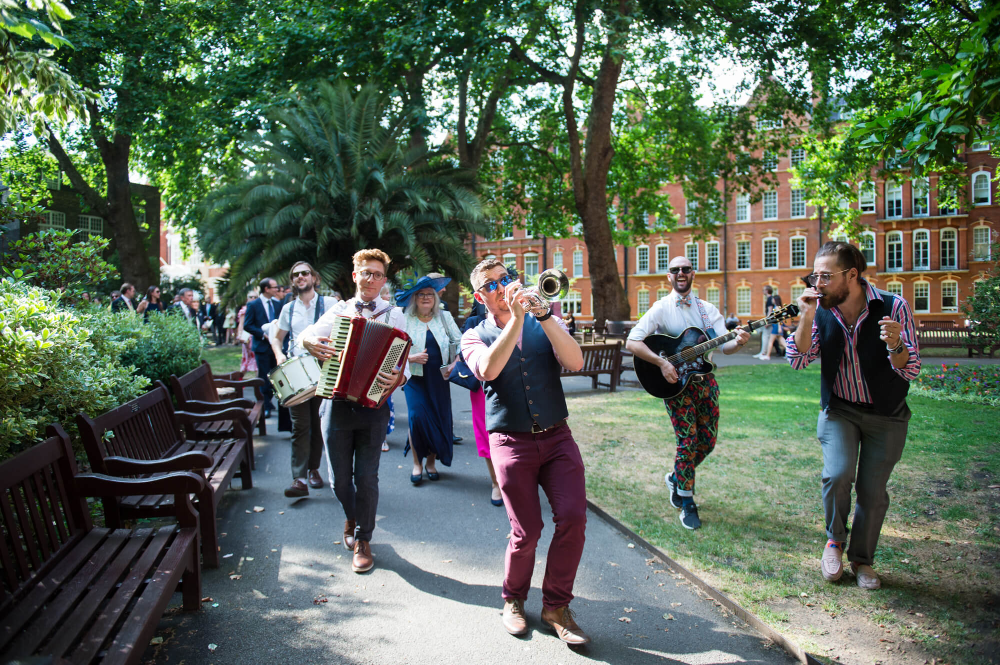 Felix Hagan dancing and playing music in a park in London
